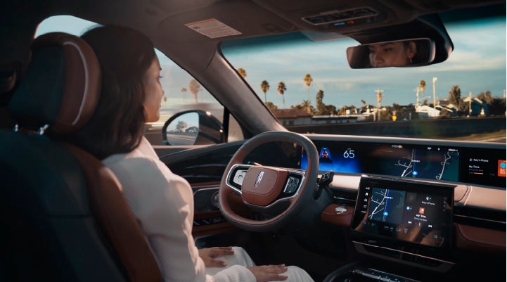 A person is shown driving hands-free on the highway with available Lincoln BlueCruise technology. | Johnson Sewell Lincoln in Marble Falls TX